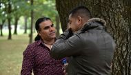 Afghan refugee and local resident Abdul Aziz (L), 48, speaks with a man who came to thank him for his bravery, during an interview with AFP in Christchurch on March 17, 2019, two days after he chased a gunman during a shooting incident at the Linwood Mosq