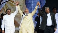 FILE PHOTO: Indian PM Narendra Modi joins hands with Maithripala Sirisena and PM Ranil Wickremesinghe after addressing a public rally in Norwood. AFP/Ishara S KODIKARA