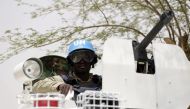 FILE PHOTO: United Nations UN soldiers patrol in the northern Malian city of Kidal on July 27, 2013. AFP/Kenzo Tribouillard