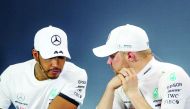 Mercedes' Finnish driver Valtteri Bottas (R) and second-placed Mercedes' British driver Lewis Hamilton attend a press conference after the Formula One Australian Grand Prix in Melbourne on March 17, 2019. AFP / Asanka Brendon Ratnayake