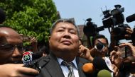 Premchai Karnasuta leaves the court after hearing the verdict against himself and three other suspects in a poaching case at Thong Pha Phum Provincial Court in Kanchanaburi province on March 19, 2019.  / AFP / Lillian Suwanrumpha 