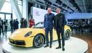 Senior officials of Porsche AG posing with the latest model.