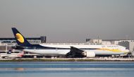 FILE PHOTO: A Jet Airways Boeing 777-300ER taxis at San Francisco International Airport, San Francisco, California, February 16, 2015. REUTERS/Louis Nastro/File Photo