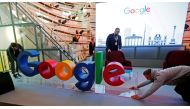 FILE PHOTO: Workers move a Google logo during the opening of the new Alphabet's Google Berlin office in Berlin, Germany, January 22, 2019. REUTERS/Hannibal Hanschke
