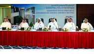 H E Salah bin Ghanim Al Ali (second right), Chairman of the Board of Barwa Real Estate Company; Issa Mohammed Al Mohannadi (second left), Vice-Chairman and Managing Director; and other Board Members, at the Company’s Annual General Meeting held yesterday 
