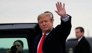US President Donald Trump waves as he arrives at Akron-Canton airport in Canton, Ohio, U.S., March 20, 2019. REUTERS/Carlos Barria