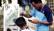 Representational image: A Rohingya refugee cuts the hair of a kid at a temporary shelter in Beras Pati after arrived from Aceh Shelter in Medan of North Sumatra, Indonesia on November 25, 2016. (Jefri Tarigan / Anadolu Agency) 