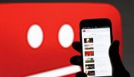 A picture illustration shows YouTube on a cell phone in front of a YouTube copyright message regarding a video on an LCD screen in central Bosnian town of Zenica, June 18, 2014. Reuters/Dado Ruvic