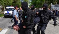 File photo of policemen detain an opposition supporter during a protest rally in Almaty, Kazakhstan May 10, 2018. REUTERS/Mariya Gordeyeva
