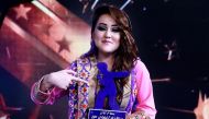  Afghan female singer Zahra Elham holds the trophy after she won the finale contest of the television music competition 'Afghan Star' in Kabul.  AFP / TOLO TV 