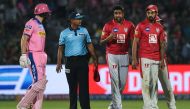 Rajasthan Royals' Jos Buttler (L) exchanges words with Kings XI Punjab's Ravichandran Ashwin (2ndR) during the 2019 Indian Premier League (IPL) Twenty20 cricket match between Rajasthan Royals and Kings XI Punjab at the Sawai Mansingh stadium in Jaipur on 