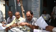 Indian election officials test and prepare Electronic Voting Machines (EVM) at a distribution centre ahead of the Indian elections in Ahmedabad on March 26, 2019. / AFP / SAM PANTHAKY