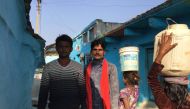 Jagdish Ahirwal (R) stands with a friend in Sunwaha village of Madhya Pradesh, India, December 12, 2018. Thomson Reuters Foundation/Roli Srivastava
