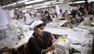  A woman works at a garment factory inside the Dhaka Export Processing Zone (DEPZ) in Savar April 11, 2013. Reuters/Andrew Biraj