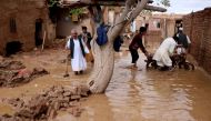 People salvage items from a house destroyed by flood in Enjil district of Herat province, Afghanistan March 29, 2019. Picture taken March 29, 2019.REUTERS/Jalil Ahmad