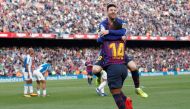 Barcelona's Lionel Messi celebrates scoring their second goal with Malcom REUTERS/Albert Gea