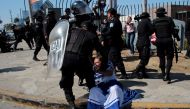 An anti-government protester in traditional costume is detained by riot police during a protest against the government of Nicaragua's President Daniel Ortega in Managua, Nicaragua March 30, 2019. REUTERS/Oswaldo Rivas
