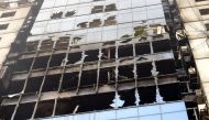 Wreckage of the burnt building is seen in Dhaka on March 29, 2019, a day after flames tore through the 22-storey FR Tower. AFP / MUNIR UZ ZAMAN