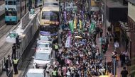 Protesters march along a street during a rally in Hong Kong on March 31, 2019 to protest against the government's plans to approve extraditions with mainland China, Taiwan and Macau.   AFP / Dale DE LA REY
