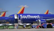 Southwest Airlines Boeing 737 MAX aircraft are parked on the tarmac after being grounded, at the Southern California Logistics Airport in Victorville, California on March 28, 2019. AFP/Mark Ralston 
