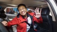 Philippine journalist Maria Ressa waves to photographers after posting bail outside a court building in Manila on March 29, 2019.  AFP / Maria Tan 