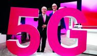 Timotheus Hoettges, CEO of Deutsche Telekom AG and Ulrich Lehner, chairman of the supervisory board, pose behind a 5G logo during the company's annual shareholders meeting in Bonn, Germany March 28, 2019. Reuters/Wolfgang Rattay