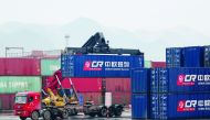 A crane lifts a China Railway Express container onto a truck at Chongqing railway port station, which serves as the start of a Belt and Road freight rail route linking Chongqing to Duisburg, China March 30, 2019. Picture taken March 30, 2019. Reuters