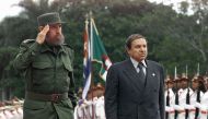 A file photo taken on April 15, 2000 shows Cuban president Fidel Castro (L) and Abdelaziz Bouteflika (R), president of Algeria, saluting troops in a ceremony in Havana. AFP / Adalberto Roque
 