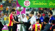 The President of Qatar Football Association, Sheikh Hamad bin Khalifa bin Ahmed Al Thani giving away the trophy to captain of Esperance Sportive de Tunis, winner of the Tunisian Super Cup played at the Abdullah bin Khalifa Stadium yesterday. 