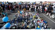 People gather around a makeshift memorial for Grammy-nominated rapper Nipsey Hussle who was shot and killed outside his clothing store in Los Angeles, California, U.S., April 1, 2019. REUTERS/Mario Anzuoni