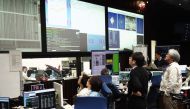 In this handout photograph taken and released by the Institute of Space and Astronautical Science (ISAS) of Japan Aerospace Exploration Agency (JAXA) on April 4, 2019, researchers and employees receive data in the control room in Sagamihara, which confirm