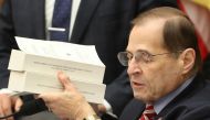 House Judiciary Chairman Rep. Jerrold Nadler (D-NY) holds up copies of the Starr Report during a House Judiciary Committee markup vote on a resolution to issue a subpoena to the Justice Department to receive the full unredacted Mueller report, on Capitol 