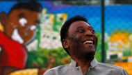 Brazilian soccer legend Pele laughs during the inauguration of a refurbished soccer field at the Mineira slum in Rio de Janeiro, Brazil September 10, 2014. Reuters/Ricardo Moraes