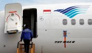 A technician prepares to check Boeing 737 Max 8 airplane of Garuda Indonesia parked at the Garuda Maintenance Facility AeroAsia at Soekarno-Hatta International airport, March 13, 2019. Reuters/Willy Kurniawan