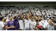 Al Sadd players and officials celebrate after winning the QNB Stars League title in Doha on Thursday.