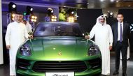 Salman Jassem Al Darwish, Chairman and CEO of Porsche Centre Doha, and other officials at the launch of the all new Macan at the Porsche Centre in The Pearl-Qatar yesterday. 
Pic: Qassim Rahmatullah / The Peninsula. 