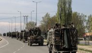 Indian security forces are transported in a convoy on a closed highway on the outskirts of Srinagar on April 7, 2019.   AFP / HABIB NAQASH