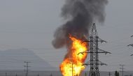 FILE PHOTO: Smoke and flames rise after an explosion at a gas pipeline in Sangachal town, 50 km from the capital of Azerbaijan, Baku, on December 27, 2016. Resul Rehimov/Anadolu Agency