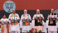 Indian Prime Minister Narendra Modi (C), chief of India's ruling Bharatiya Janata Party (BJP) Amit Shah (2-R), India's Home Minister Rajnath Singh (2-L) India's Foreign Minister Sushma Swaraj (L) and India's Finance Minister Arun Jaitley display copies of