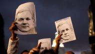 Supporters of WikiLeaks founder Julian Assange demonstrate in front of presidential palace regarding his Ecuadorian citizenship in Quito, Ecuador, October 31, 2018. Reuters/Daniel Tapia