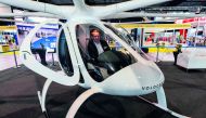 hristian Bauer, Volocopter's head of business development, poses sitting in a passenger drone Volocopter 2X during a media preview at Rotorcraft and Unmanned Systems exhibition in Singapore on April 8, 2019. / AFP / Roslan Rahman

