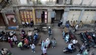 People walk through the Bhendi Bazaar area of Mumbai on December 2, 2016. AFP/Indranil Mukherjee