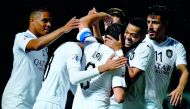 Al Sadd’s Spanish midfielder Xavi Hernandez (centre) is congratulated by team-mates after he scored the second goal against Uzbekistan’s Pakhtakor during their AFC Champions League (ACL) Group D match yesterday.
