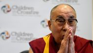 FILE PHOTO: Tibetan spiritual leader the Dalai Lama, Patron of Children in Crossfire, gestures during a press conference in Londonderry, Northern Ireland September 11, 2017. REUTERS/Clodagh Kilcoyne/File Photo