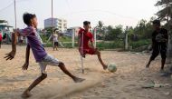 This photo taken on April 2, 2019 shows Kaung Khant Lin (R) fighting for the ball during a football match in Yangon. Football-mad Myanmar teen Kaung Khant Lin roots for Manchester United, worships star Lionel Messi and was honoured as the best player in a