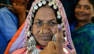 An Indian lambadi tribeswoman shows her ink-marked finger after voting at a polling station during India's general election at Pedda Shapur village on the outskirts of Hyderabad on April 11, 2019. AFP / NOAH SEELAM
