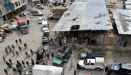 Rescue workers and army soldiers gather at the site of a blast at a vegetable market in Quetta, Pakistan April 12, 2019. REUTERS/Naseer Ahmed