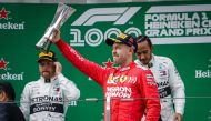 German driver Sebastian Vettel (C) of Ferrari celebrates on the podium after placing third in the F1 Grand Prix of China at Shanghai International Circuit on April 14, 2019 in Shanghai, China. Stringer - Anadolu 
