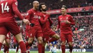 Liverpool's Egyptian midfielder Mohamed Salah (C) celebrates with teammates after scoring their second goal during the English Premier League football match between Liverpool and Chelsea at Anfield in Liverpool, north west England on April 14, 2019. AFP /
