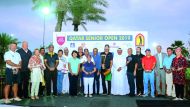The podium winners at the Qatar Senior Open golf tournament pose for a picture with officials of Qatar Golf Association at Doha Golf Club. 
